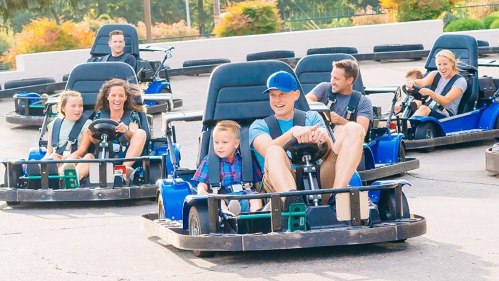 Parents and children riding in go-karts