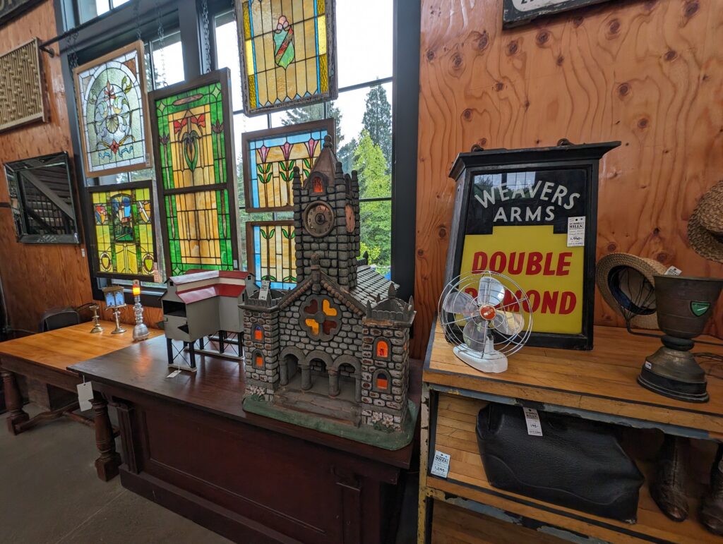 The Gift Giver's Guide itinerary cover photo showing antiques inside Aurora Mills