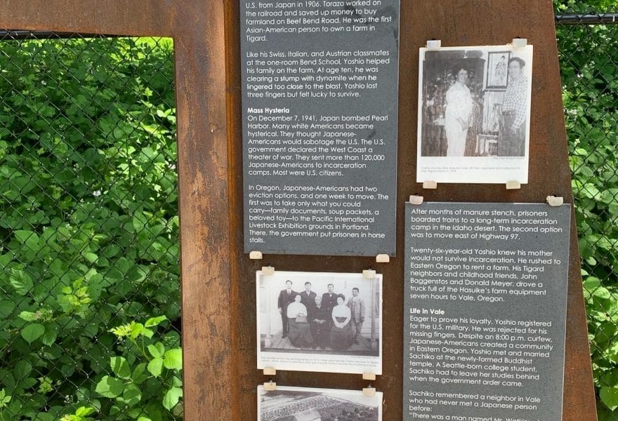 A custom outdoor sign displaying a historical story and pictures