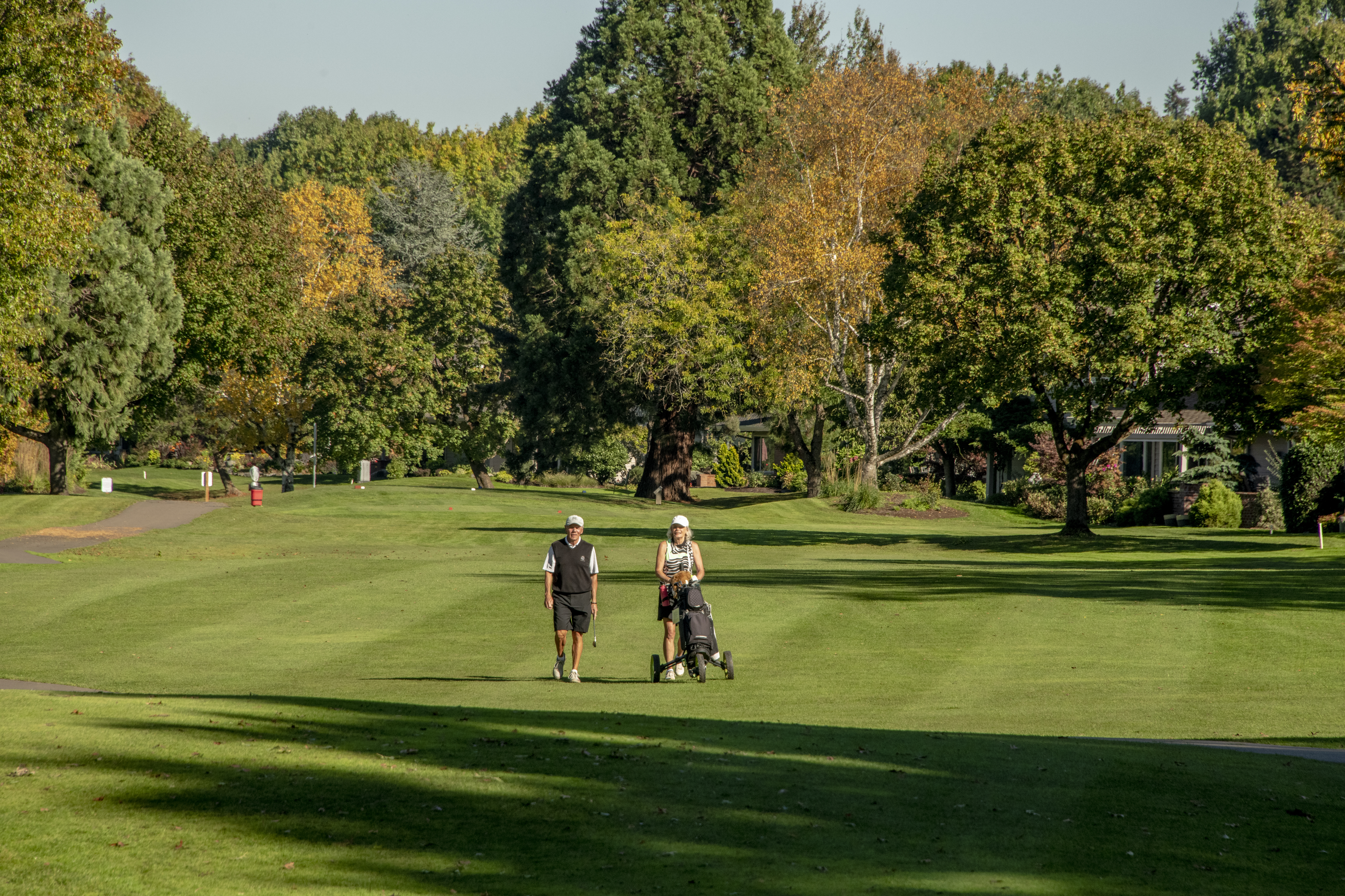 photo of golfers walking course at Charbonneau Golf Club in Wilsonville, Oregon