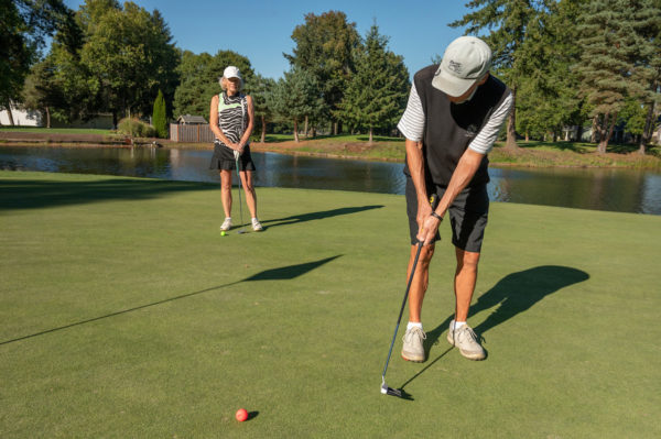 Couple golfing at Charbonneau Golf Club