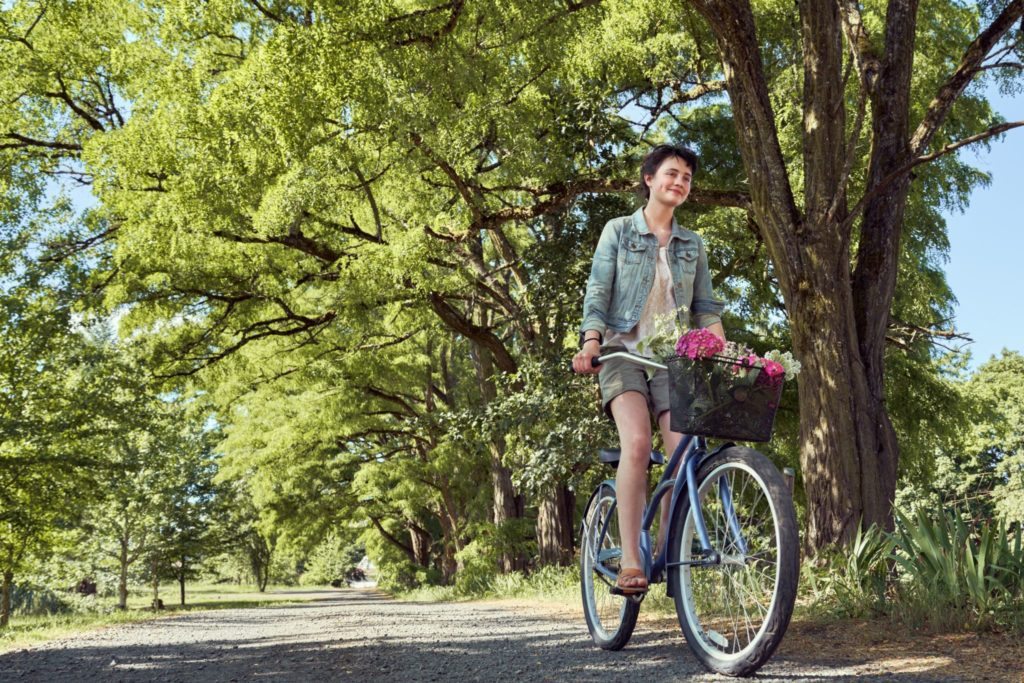 Woman riding her bike on a trail
