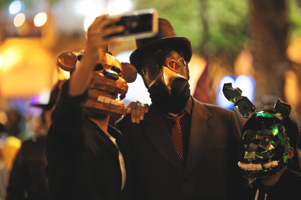 photo of three people taking a selfie together in Halloween costumes