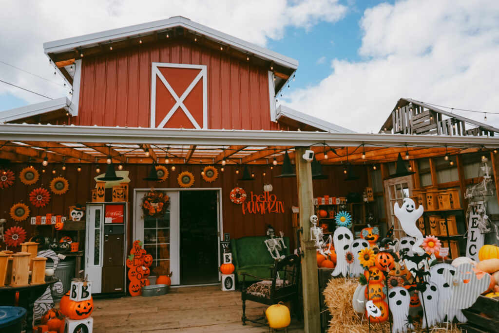 Photo of red barn with halloween decor out front at Yesteryear Farms in Wilsonville, Oregon