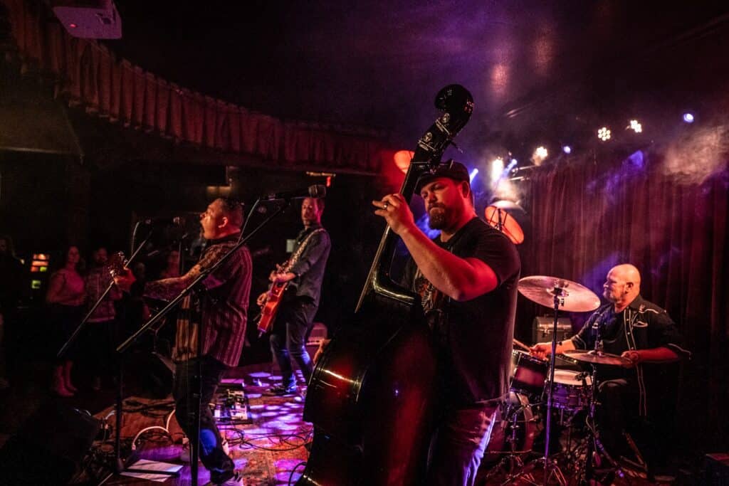 Photo of the Portland, Oregon band named The Dry County Crooks performing live on stage.