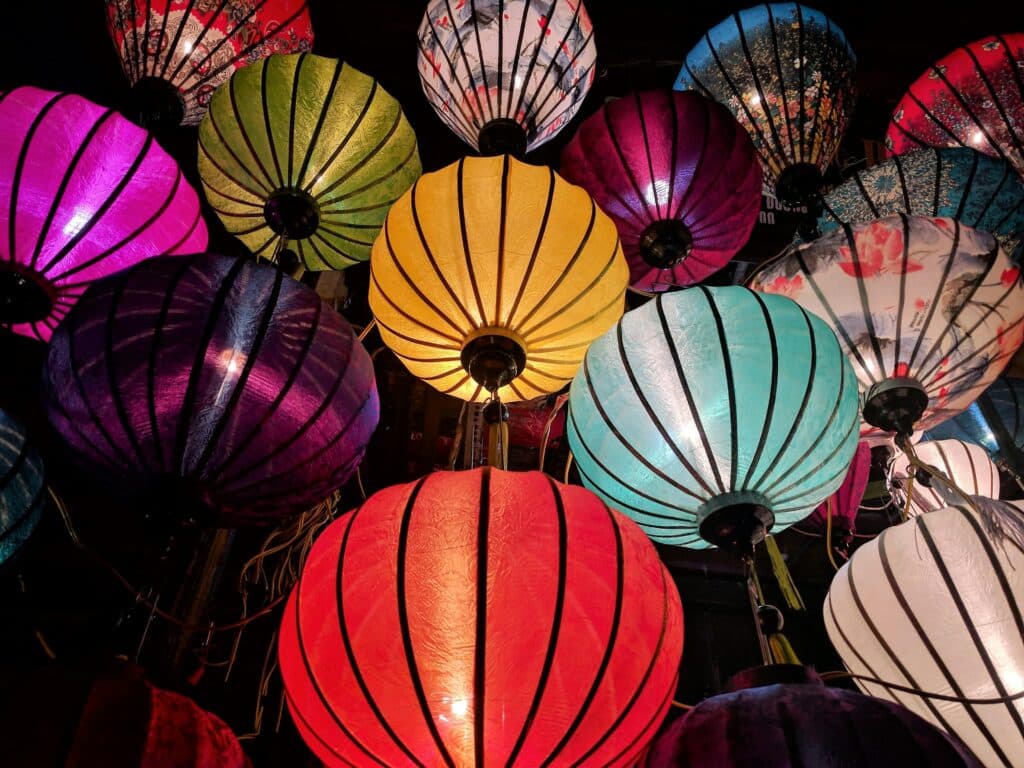 Photo of a dozen Lunar New Year lanterns all in different bright colors