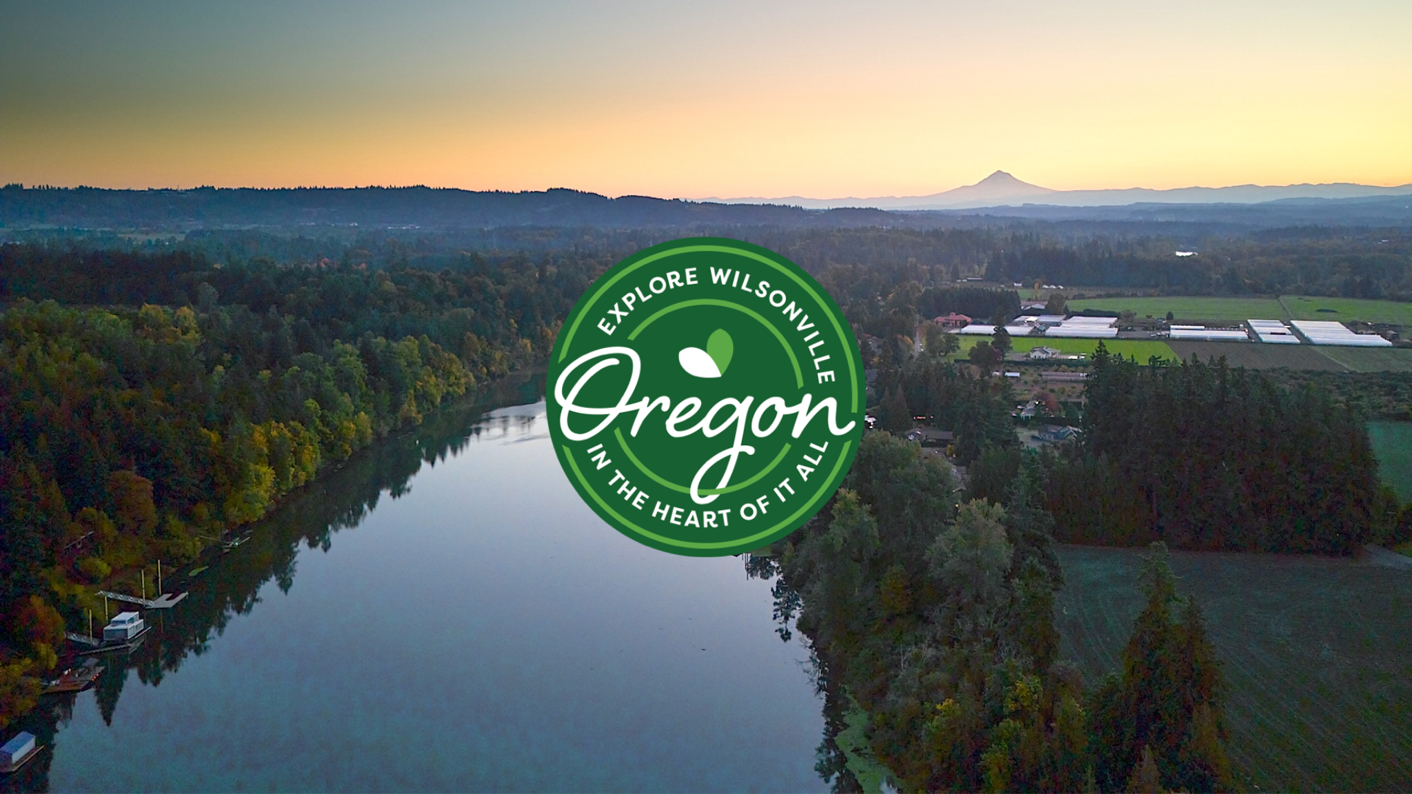 Aerial photo taken of Wilsonville, Oregon that prominently features local farms, the Willamette River and Mount Hood