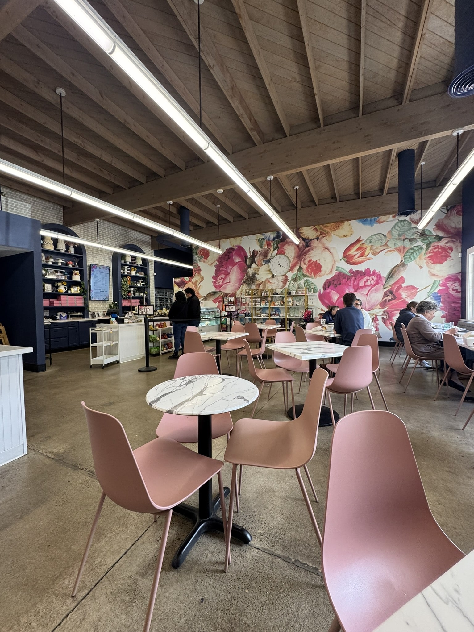 Photo of the inside of Lux Sucre in Wilsonville, Oregon that highlights the floral mural wall | From the blog: "Wilsonville - A Global Getaway That May Just Surprise You".