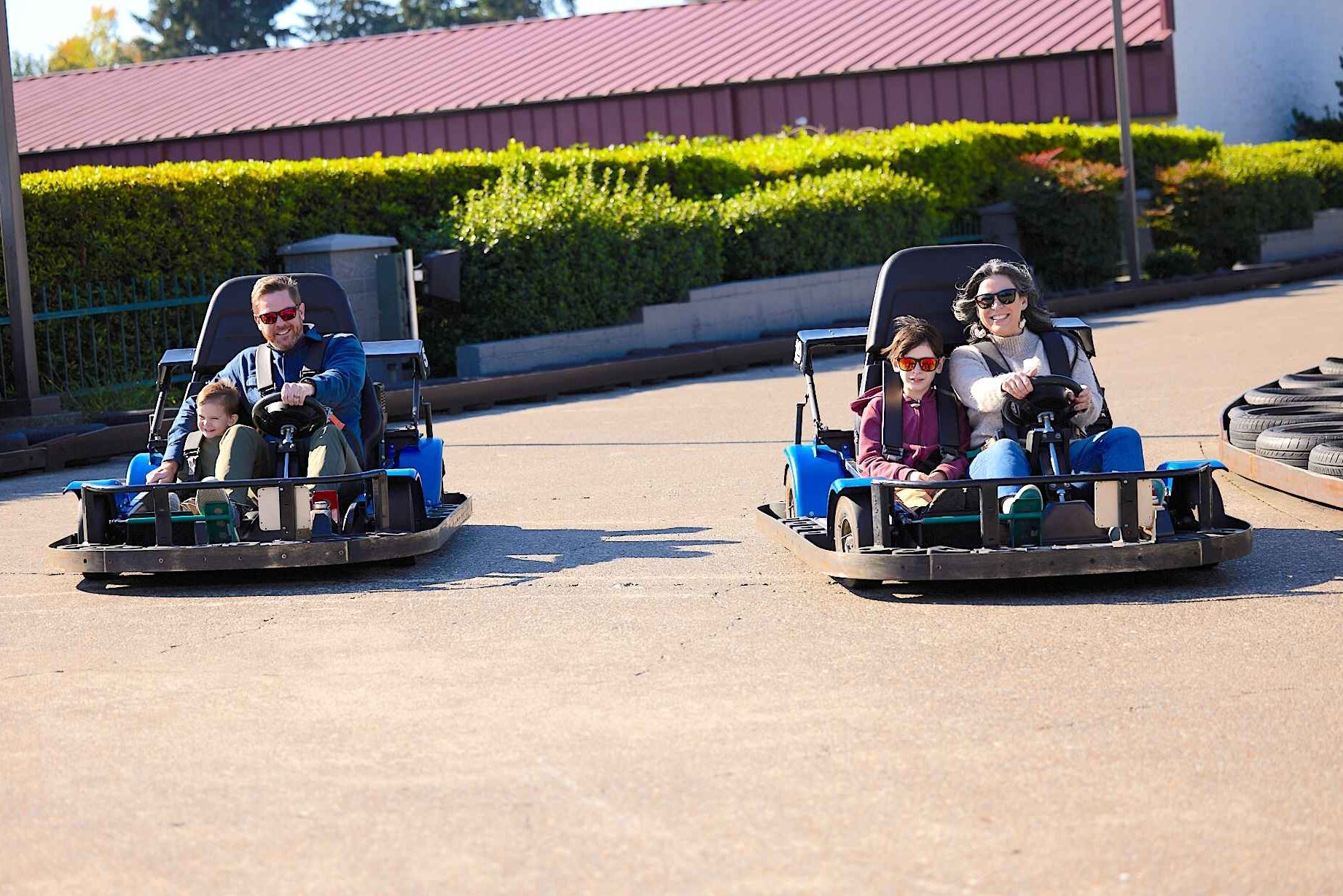 Family of four enjoying the go kart track at Bullwinkle's in Wilsonville, Oregon