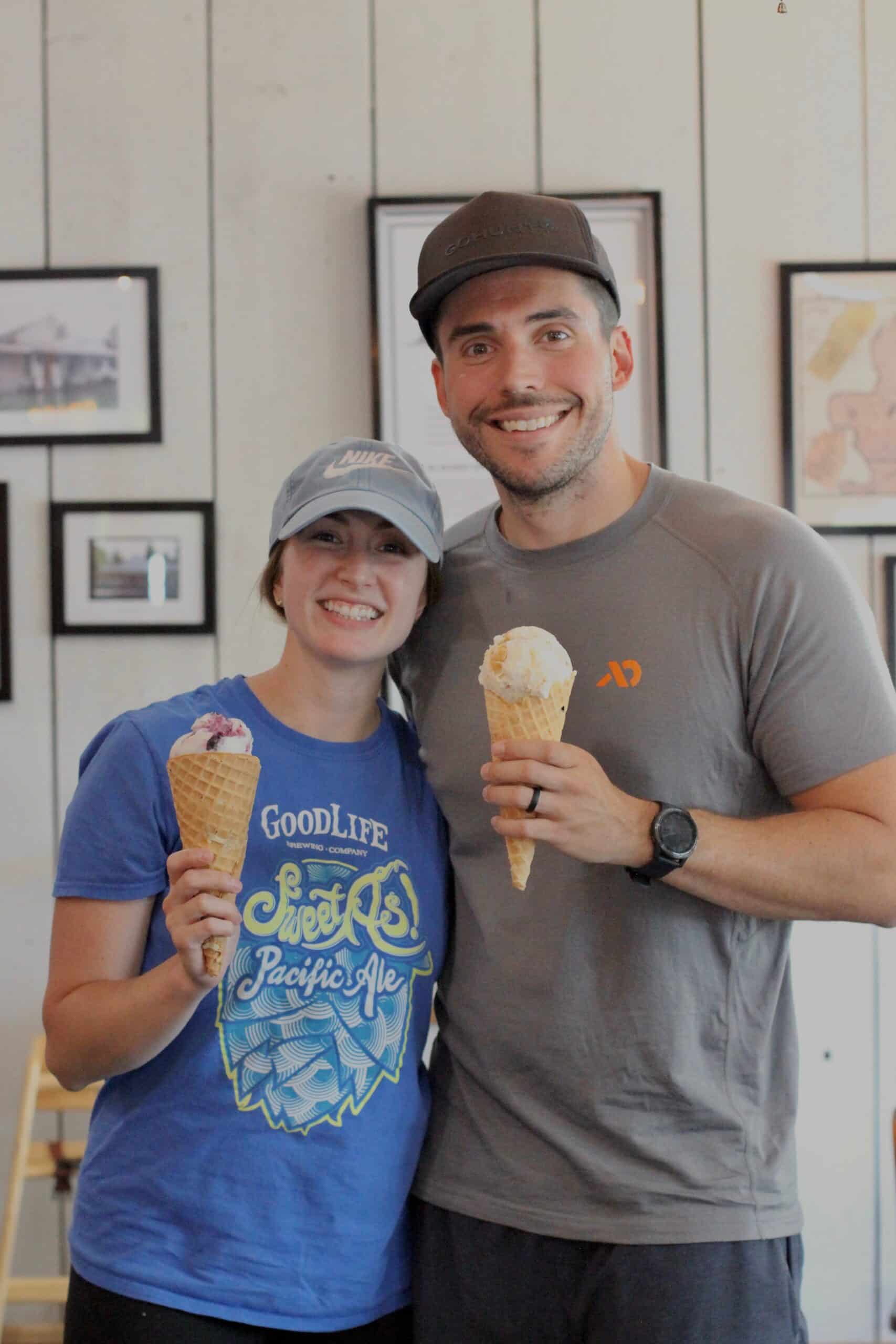 photo of two young adults smiling with their ice cream cones while standing inside the Historic Buttevill Store near Wilsonville, Oregon