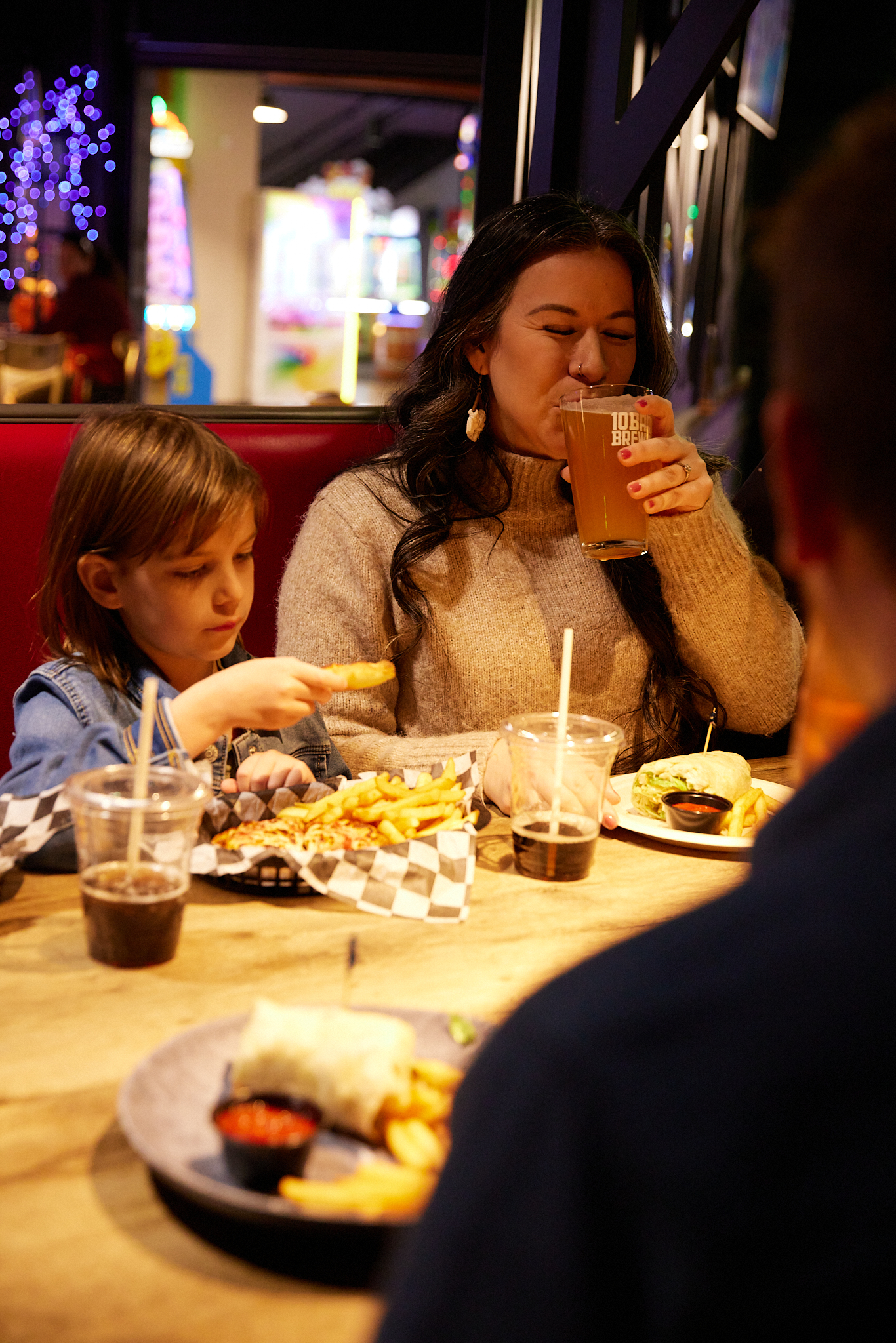 Photo of a mother and child eating at Bullwinkle's Family Fun Center | Accessible Travel Fall Wilsonville Oregon