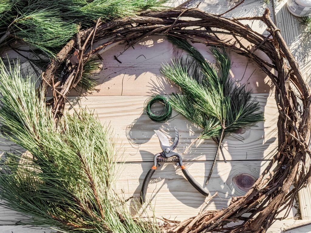 photo of holiday wreath being built