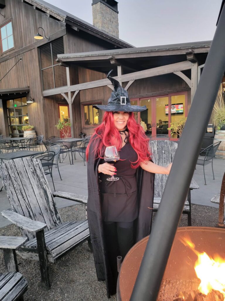 photo of witch drinking wine at Tumwater Vineyard